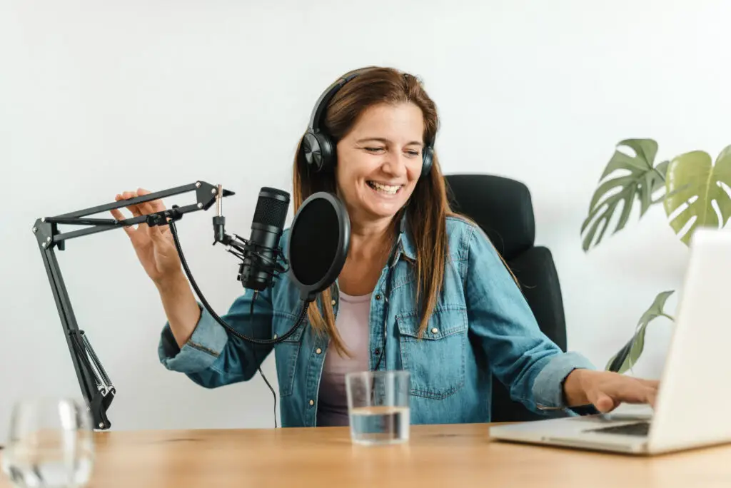 Young woman recording a digital marketing podcast in Grand Rapids, MI about boosting posts on facebook.