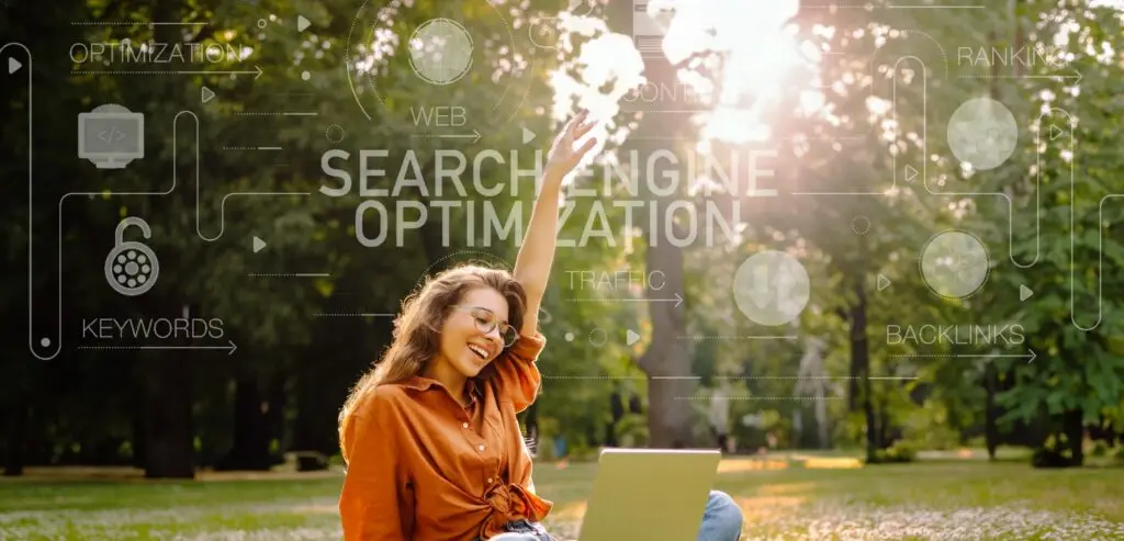 Woman sits outside on her laptop, grateful that Filla Life Media has helped her company secure SEO backlinks.